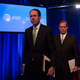 AT&T executives exit a news conference. (Photo: Getty)
